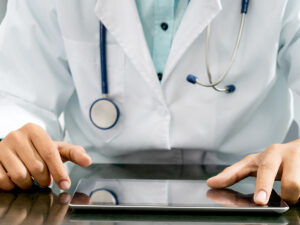 Image of a Doctor with an Ipad.