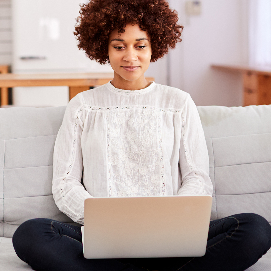 Happy woman using a laptop