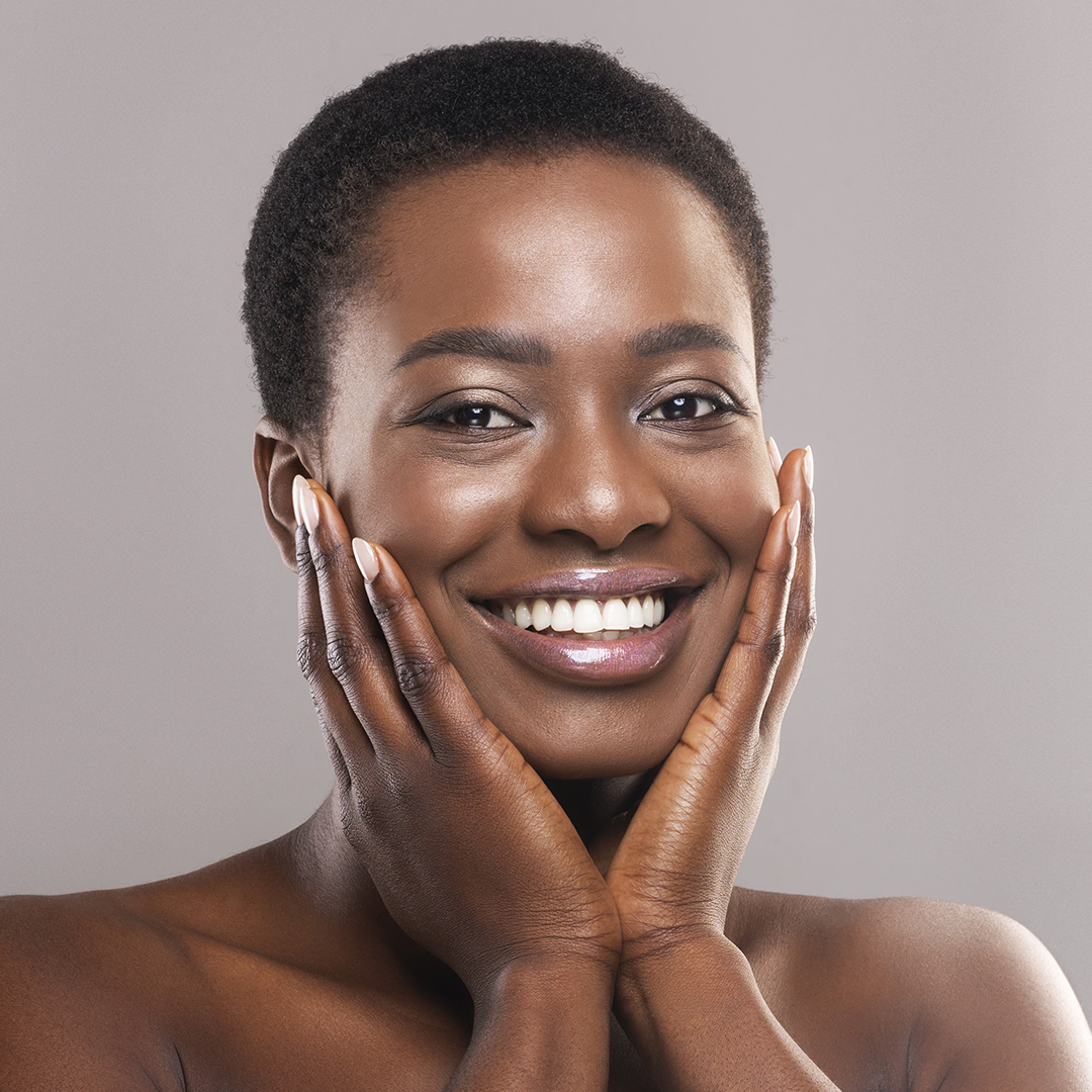 Happy woman touching her face
