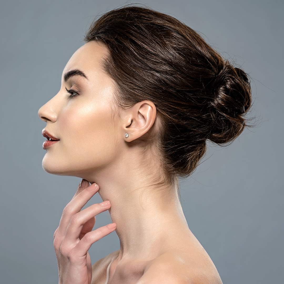 Happy woman touching her chin