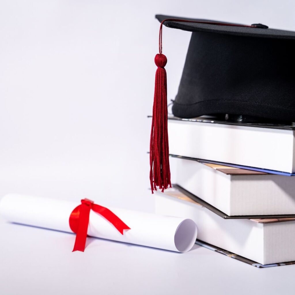 medical books, cap, and certification