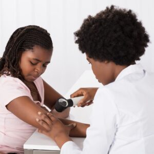 dermatologist looking at skin