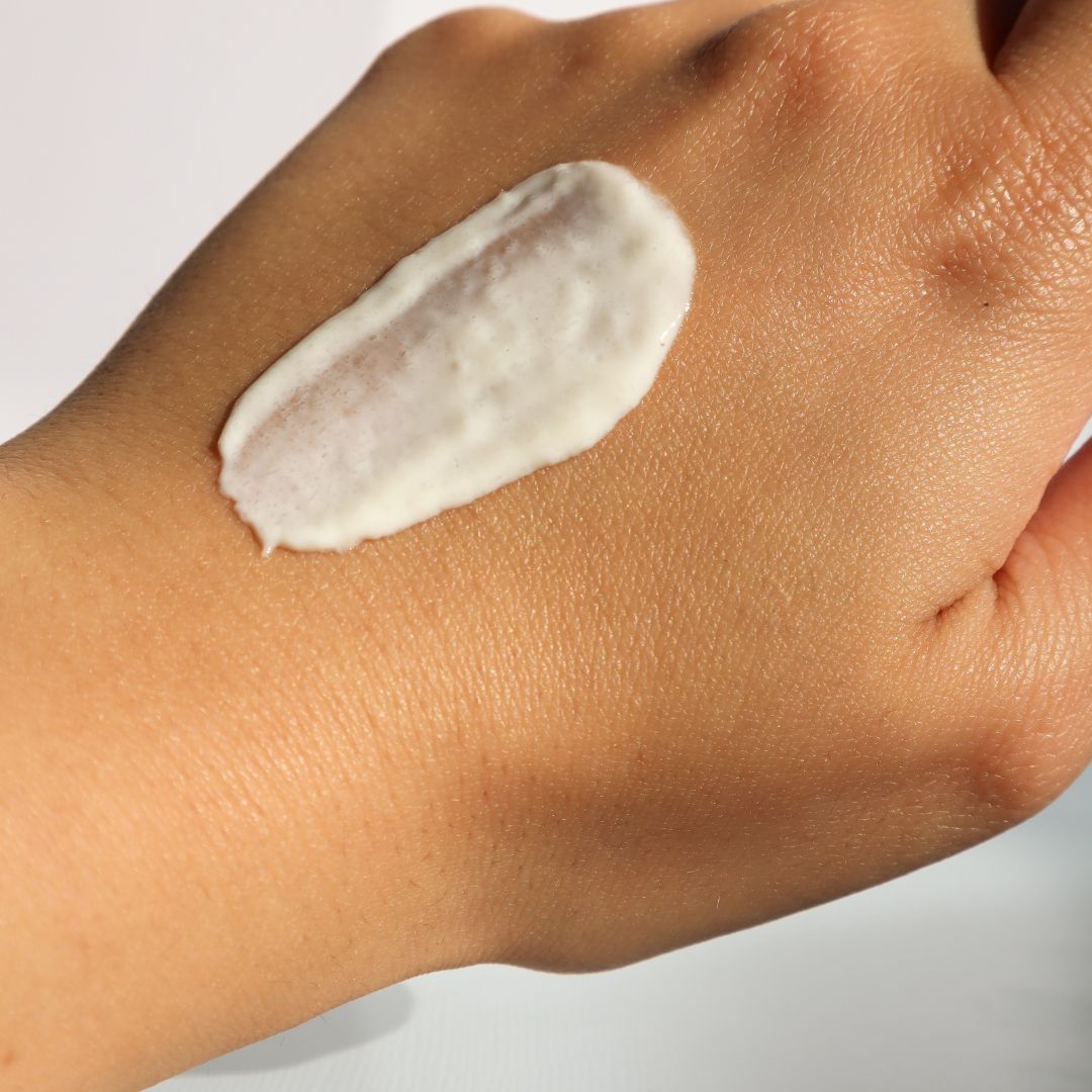 sunscreen on a person's hand