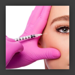 Woman receiving injectable to combat crow's feet