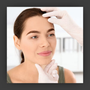 Woman having her skin examined
