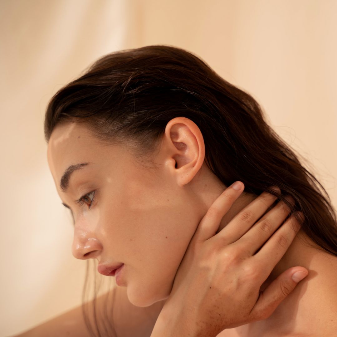 A women stroking her skin