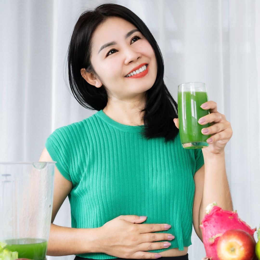 A woman drinking a shake
