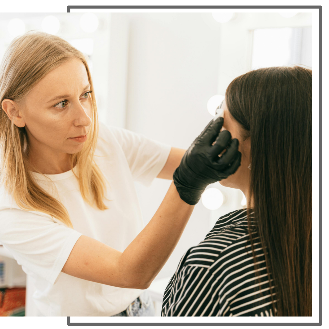 dermatologist looking at a patient's skin